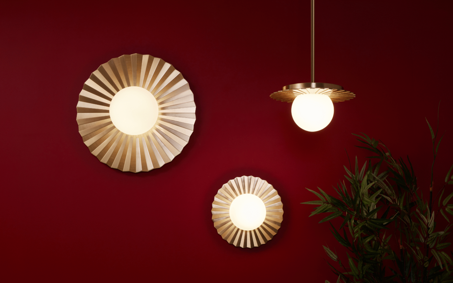 Vistal lighting collection, one pendant and two wall lights with metal sunbeam accents