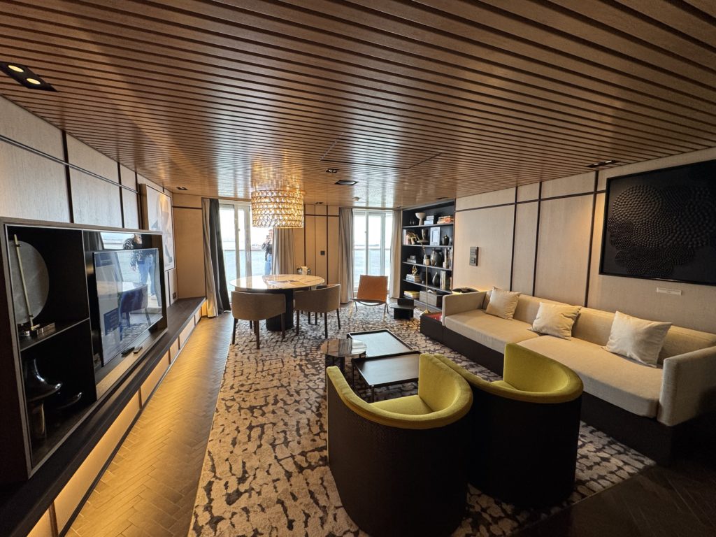 The living room in the Owners Suite aboard Norwegian Aqua. Photo: Henrik Olsen