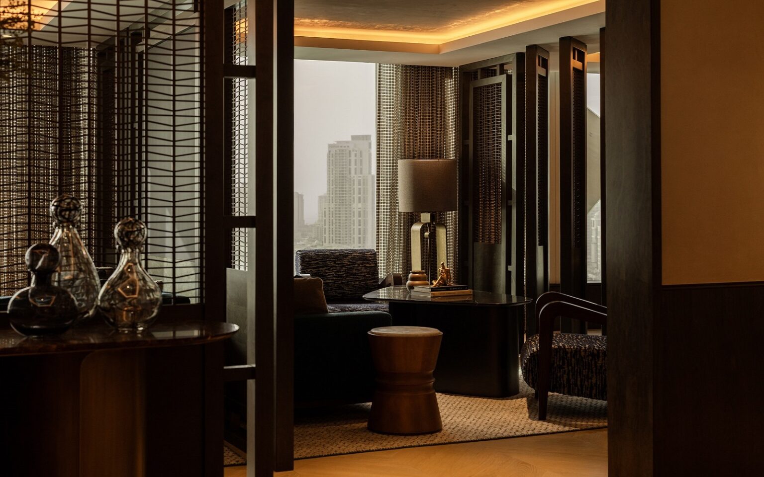Rosewood doha seating space in clubhouse lounge with view across Doha