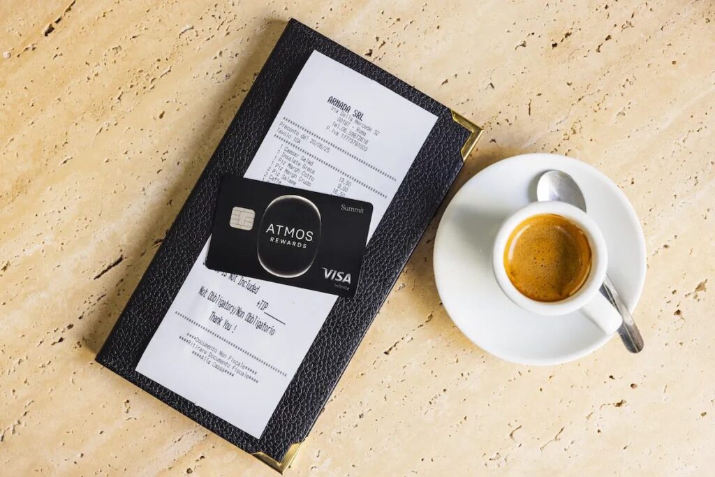 a credit card and a menu on a table