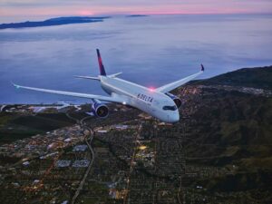an airplane flying over a city