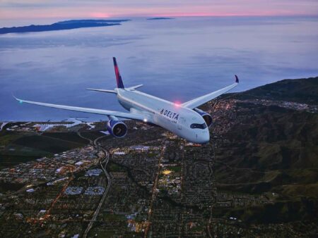 an airplane flying over a city