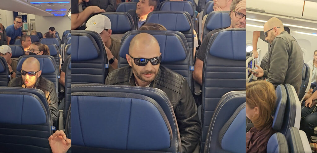 a man in sunglasses sitting in a plane