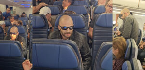 a man in sunglasses sitting in a plane
