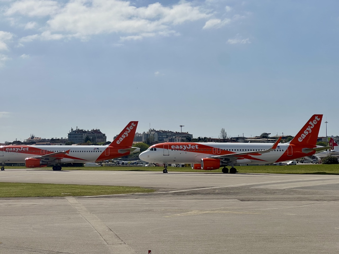 EasyJet Airbus A320s on the tarmac in Lisbon, Portugal.