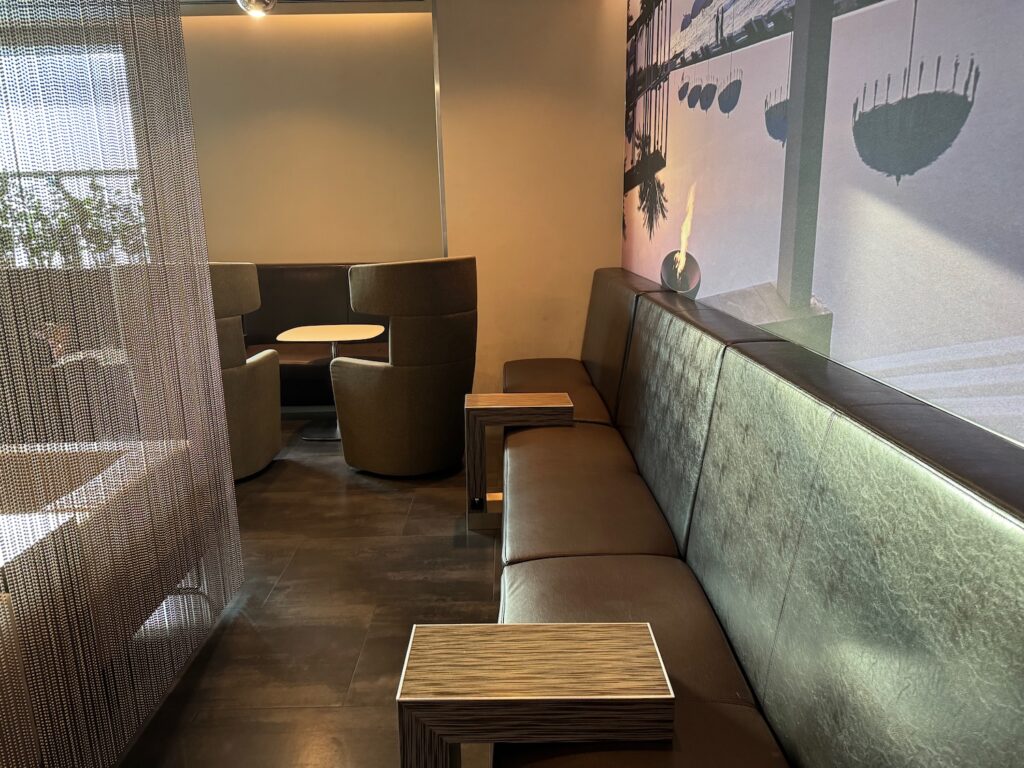 a couch with chairs and tables in a room