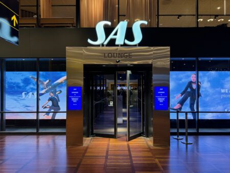 a glass doors leading to a lounge
