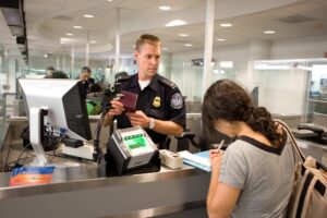a police officer at a check-in counter
