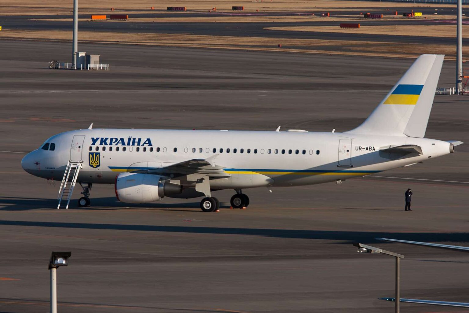 a white airplane on a runway