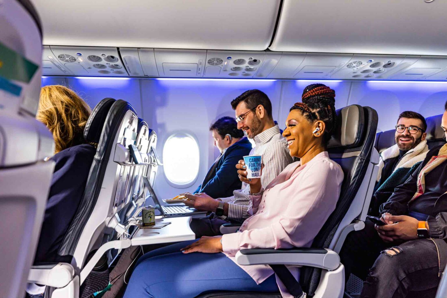 a group of people sitting in an airplane