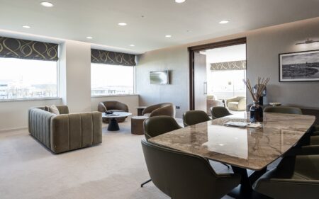 dining table, couch and seating from BoConcept in hotel room with skyline views
