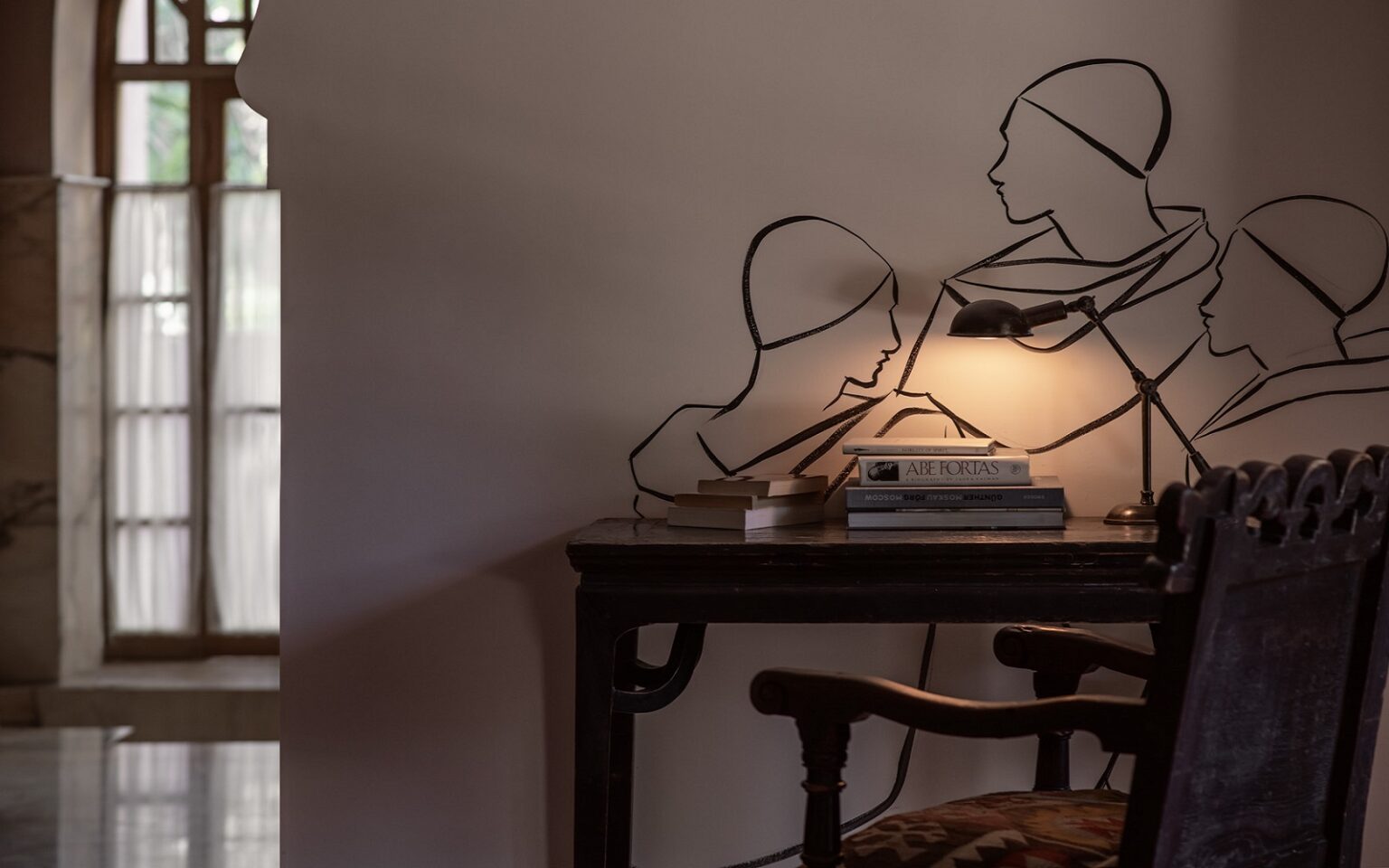 Beyond the frame – art and hotel design line drawing on the wall behind the desk in Jnane Rumi