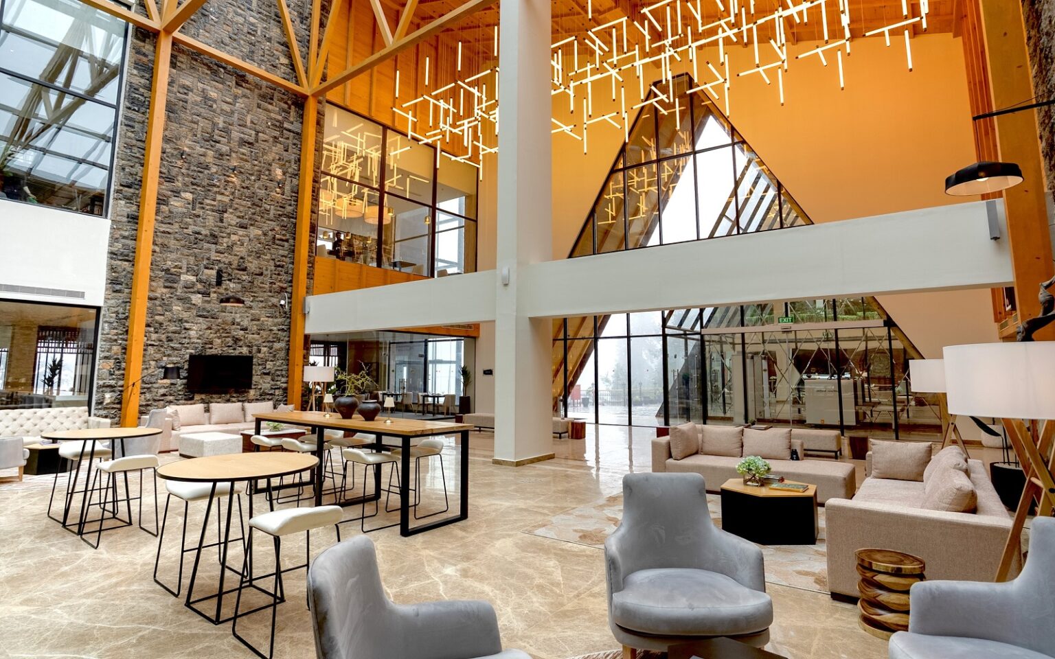 hotel lobby double volume in a-frame style design DoubleTree by Hilton Nathiagali