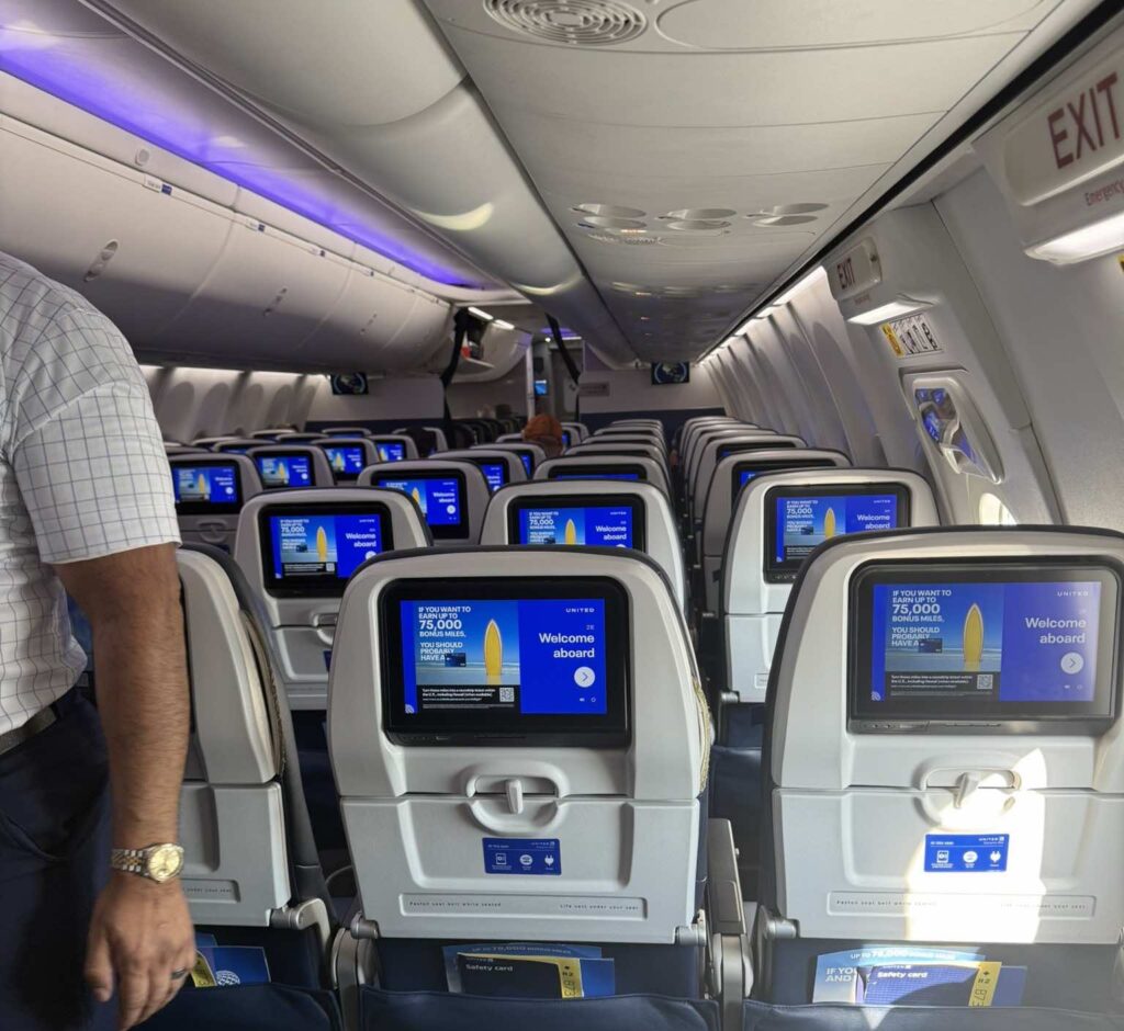 a man standing in an airplane