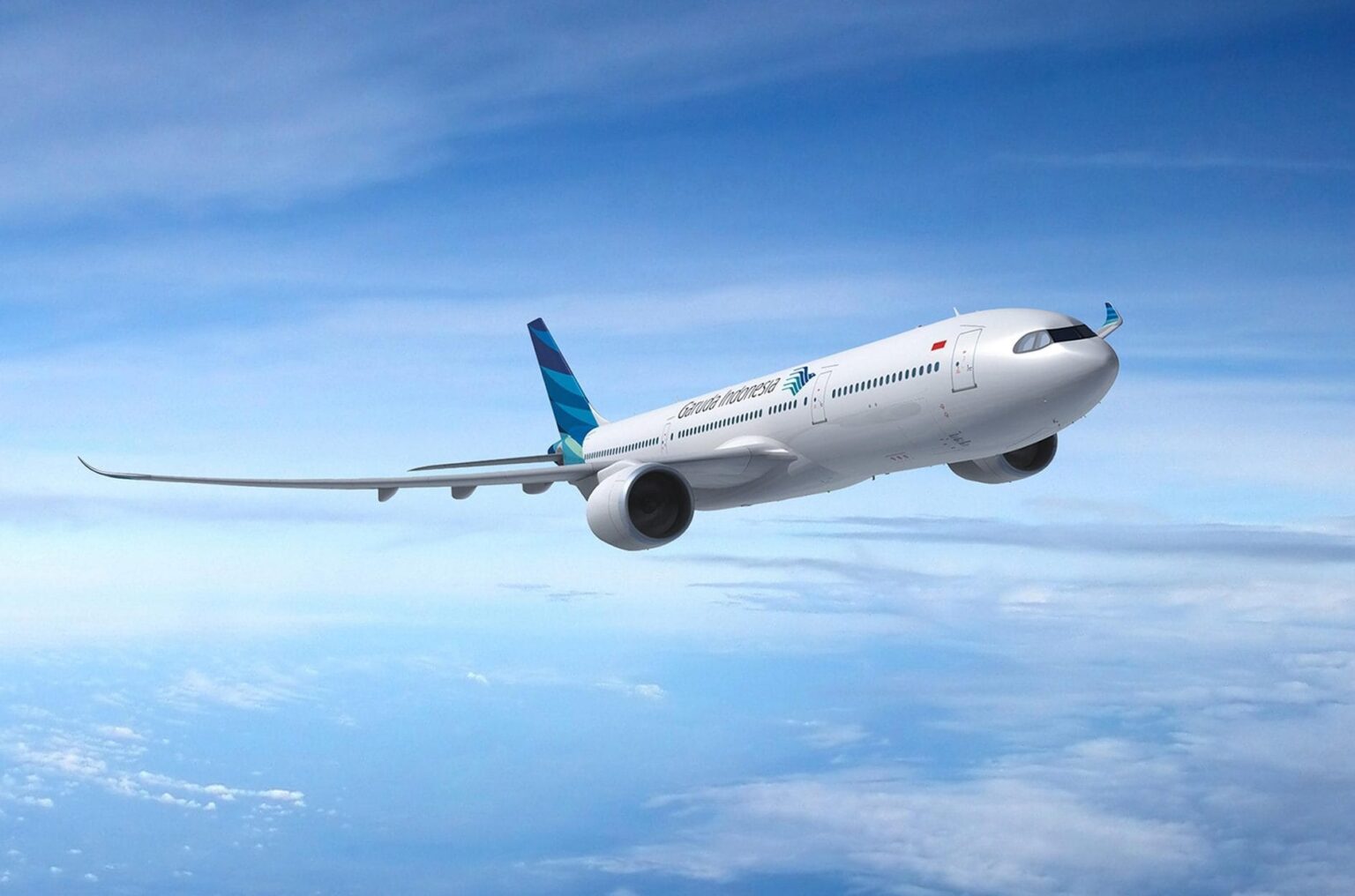 a white airplane flying in the sky