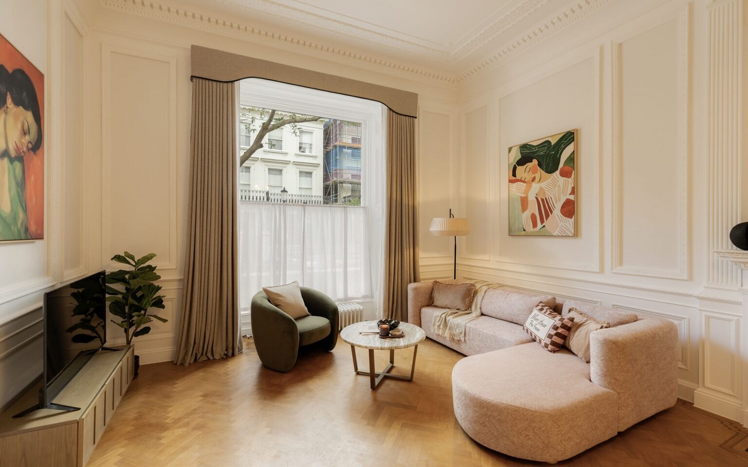 Your Apartment – continuing the vision in Notting Hill cream couch on wooden floor in front of period style London window