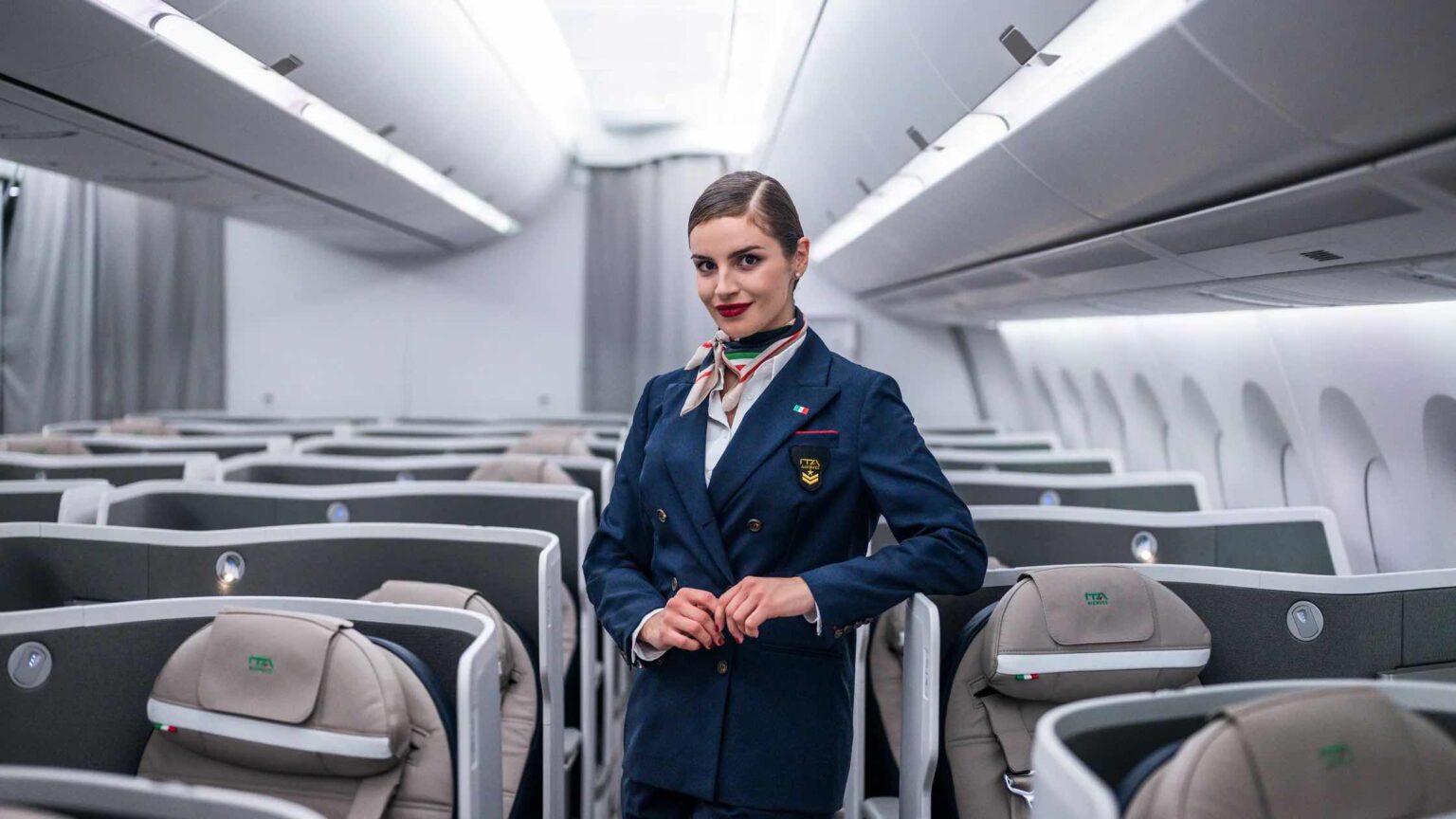 a woman in a uniform standing in a row of chairs