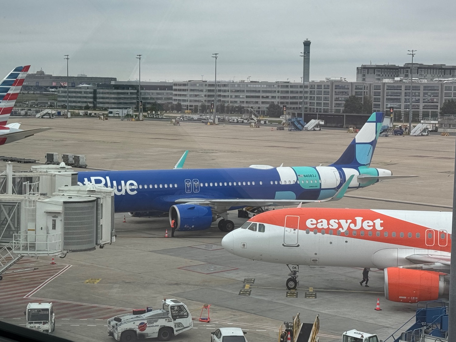 a group of airplanes parked at an airport