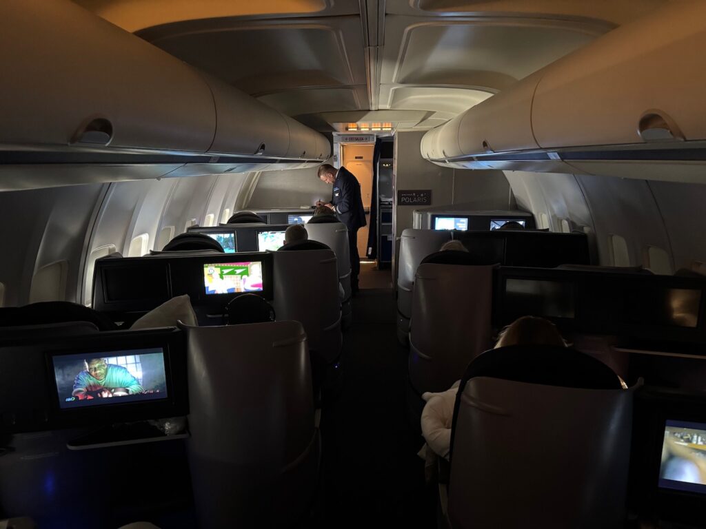 a person standing in the back of an airplane
