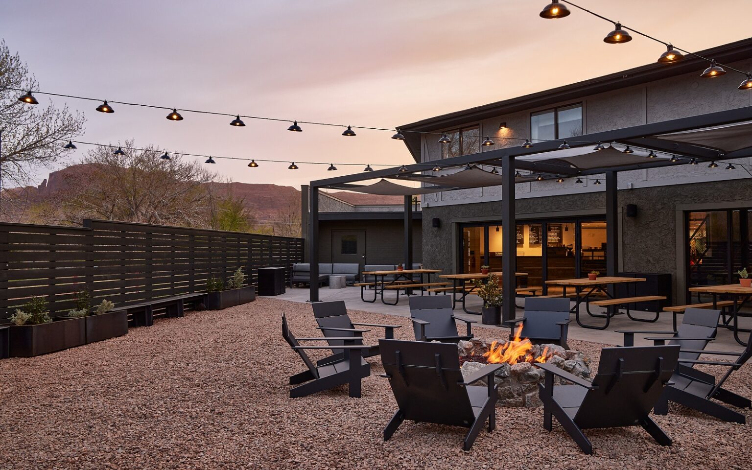 Launch of Outset Collection by Hilton outdoor seating around a firepit