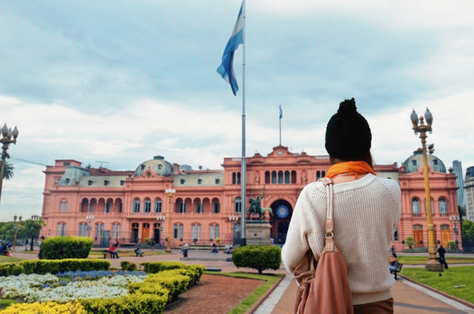 This couple was scammed into paying nearly $30,000 for lunch in Buenos Aires. Would Chase accept their dispute? Young Woman walking at Plaza de Mayo Square in Buenos Aires, Argentina