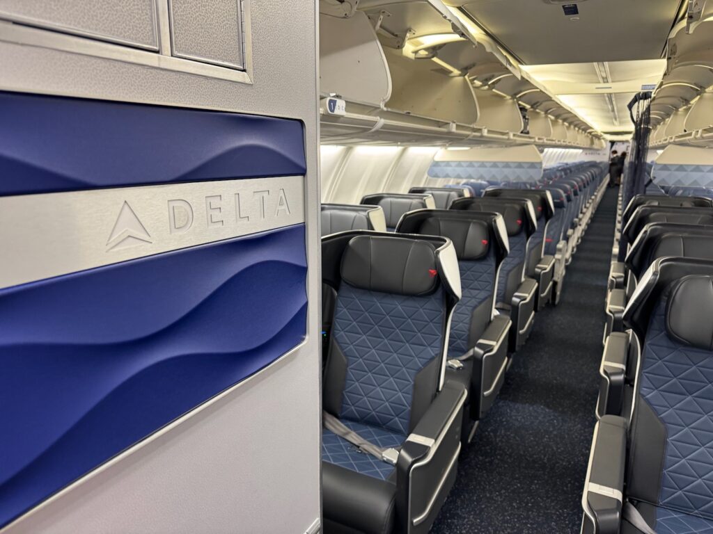 Review: Delta Air Lines 737-800 First Class a row of seats on an airplane