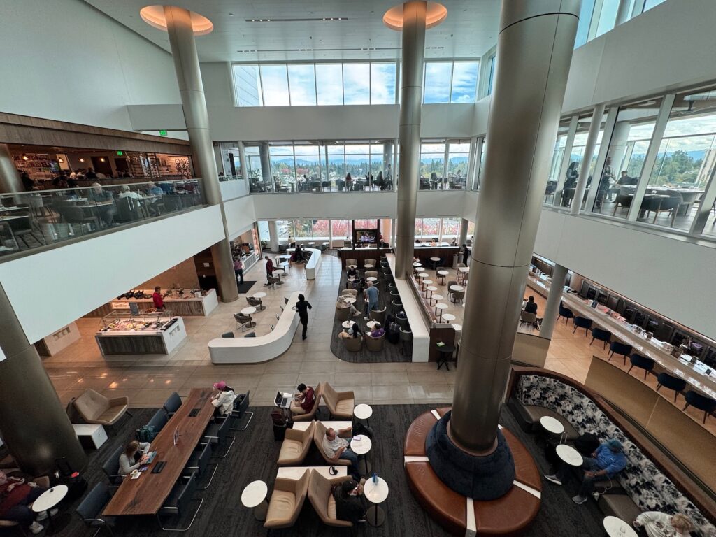 Review: Delta Sky Club Seattle A11 (SEA) a large building with many tables and chairs