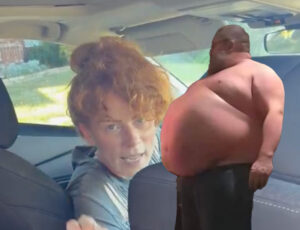 a woman in a car with a man in the back