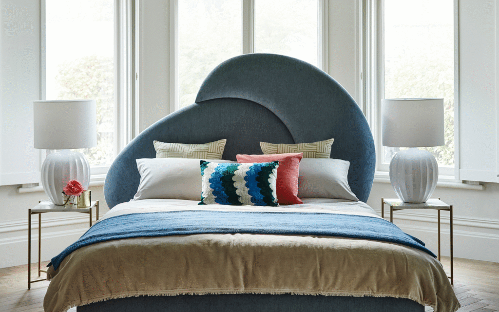 Options for every aesthetic: award-winning bedframes from sofa.com Curved frame navy velvet headboard on sofa.com bed