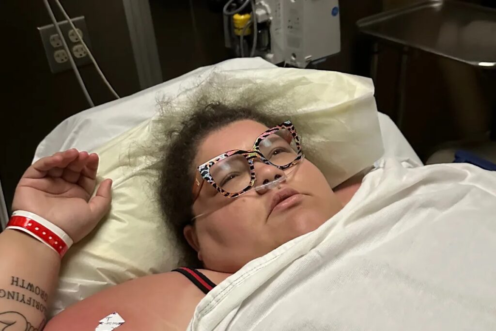 Plus-Size Travel Influencer Jaelynn Chaney’s Downward Spiral: From Free Flights To Jail Cell a woman lying in a hospital bed