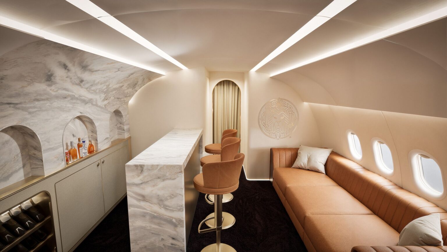 Magnifica Air Promises “Private Class” Travel, But Its $14,995 Membership Fee Is A Mystery a room with a couch and bar stools