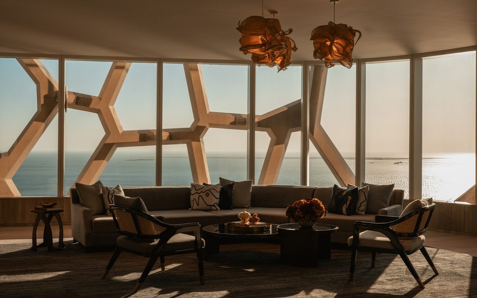 Rosewood reimagined – a bold new visual identity architectural framework to window overlooking the sea from Rosewood hotels