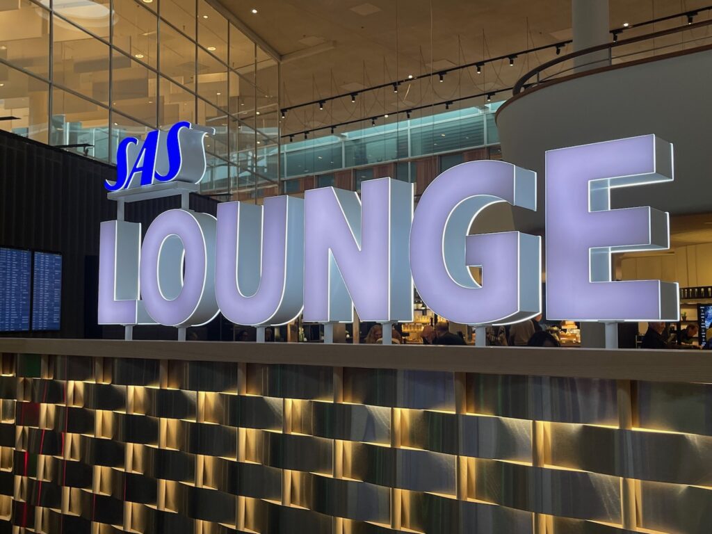 SAS Combines Gold And Business Lounges Across Scandinavia a sign in a building