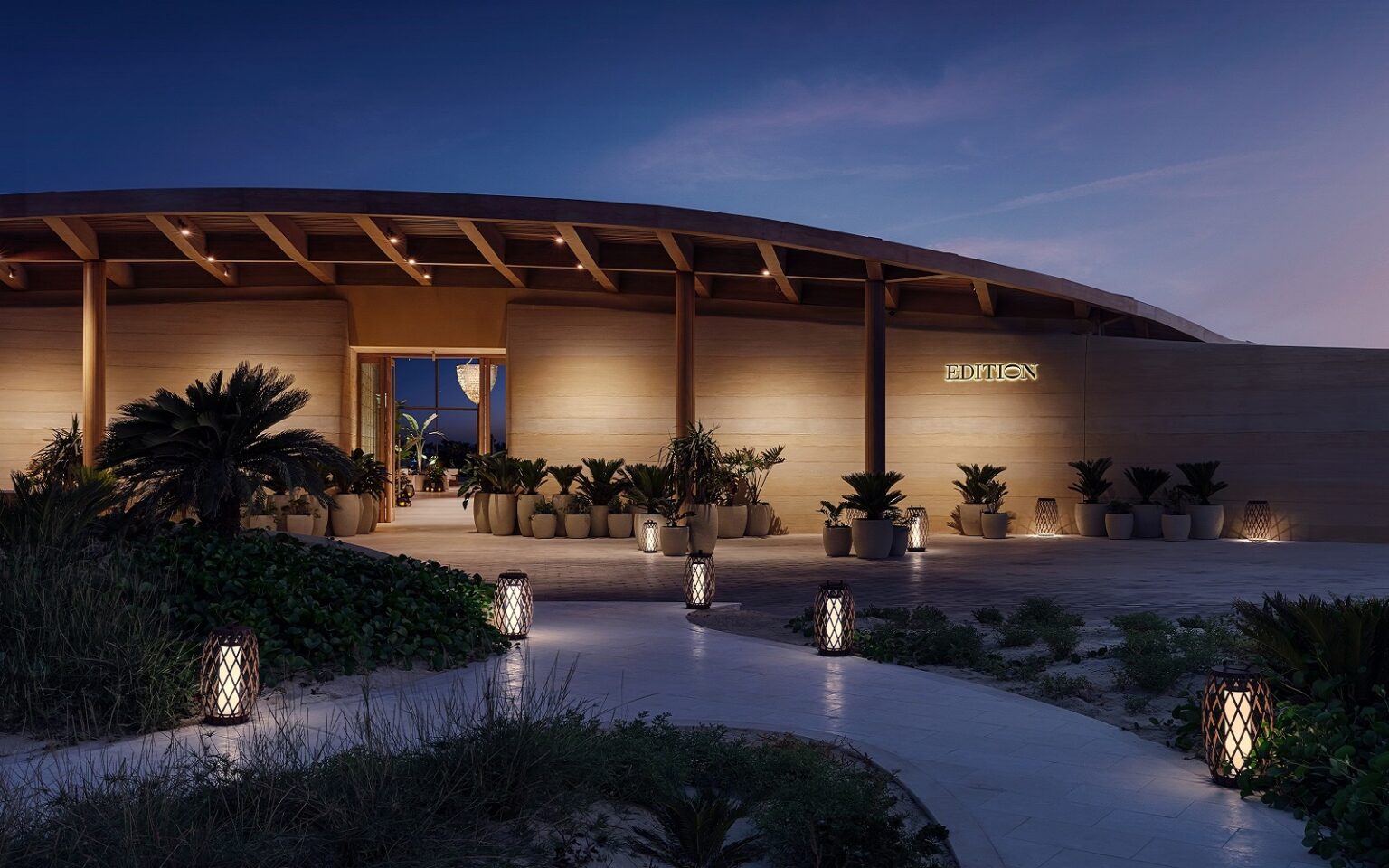 Red Sea EDITION opens as the first hotel on Shura Island path leading up to entrance The Red Sea EDITION_with path and facade lighting