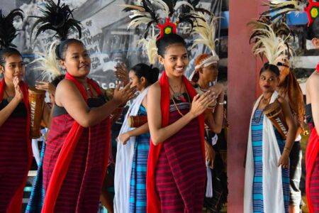 a group of women wearing colorful dresses