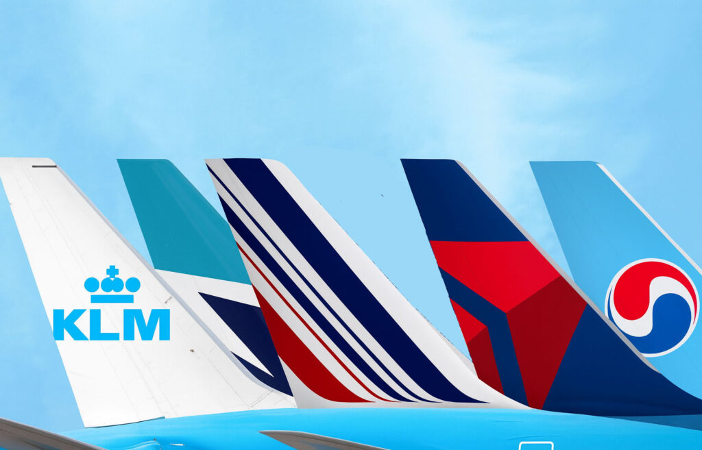 Delta, Air France-KLM, And Korean Air Take Stakes In WestJet a group of tail fin of an airplane
