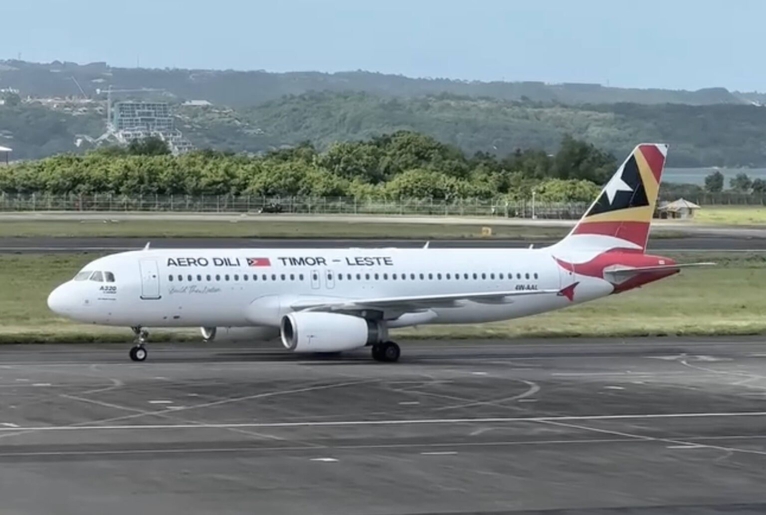 Booked: I’m Flying To Timor-Leste On Aero Dili! a white airplane on a runway