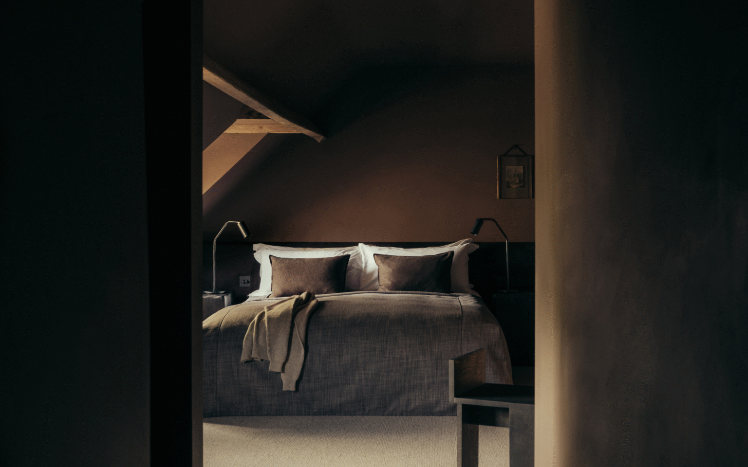Dark brown painted bedroom with curved ceiling