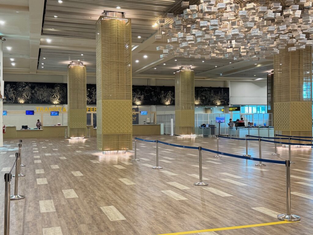 So Close, Yet So Far: My Attempt To Reach Timor-Leste Falls Apart a large hall with columns and a blue rope