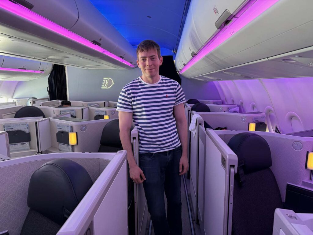 a man standing in a row of seats