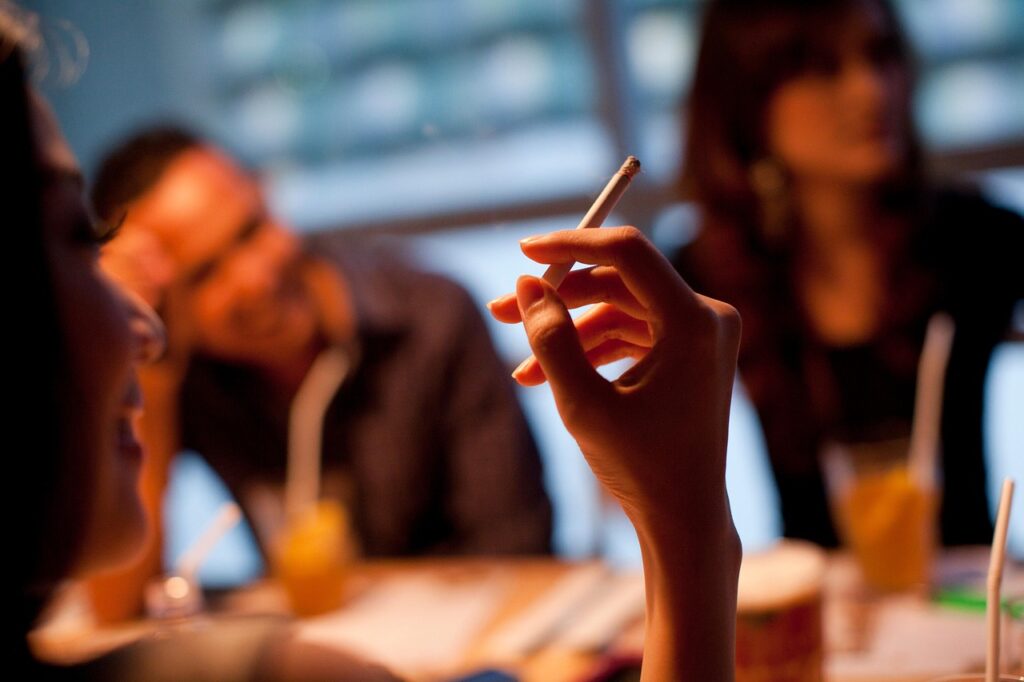 a hand holding a cigarette