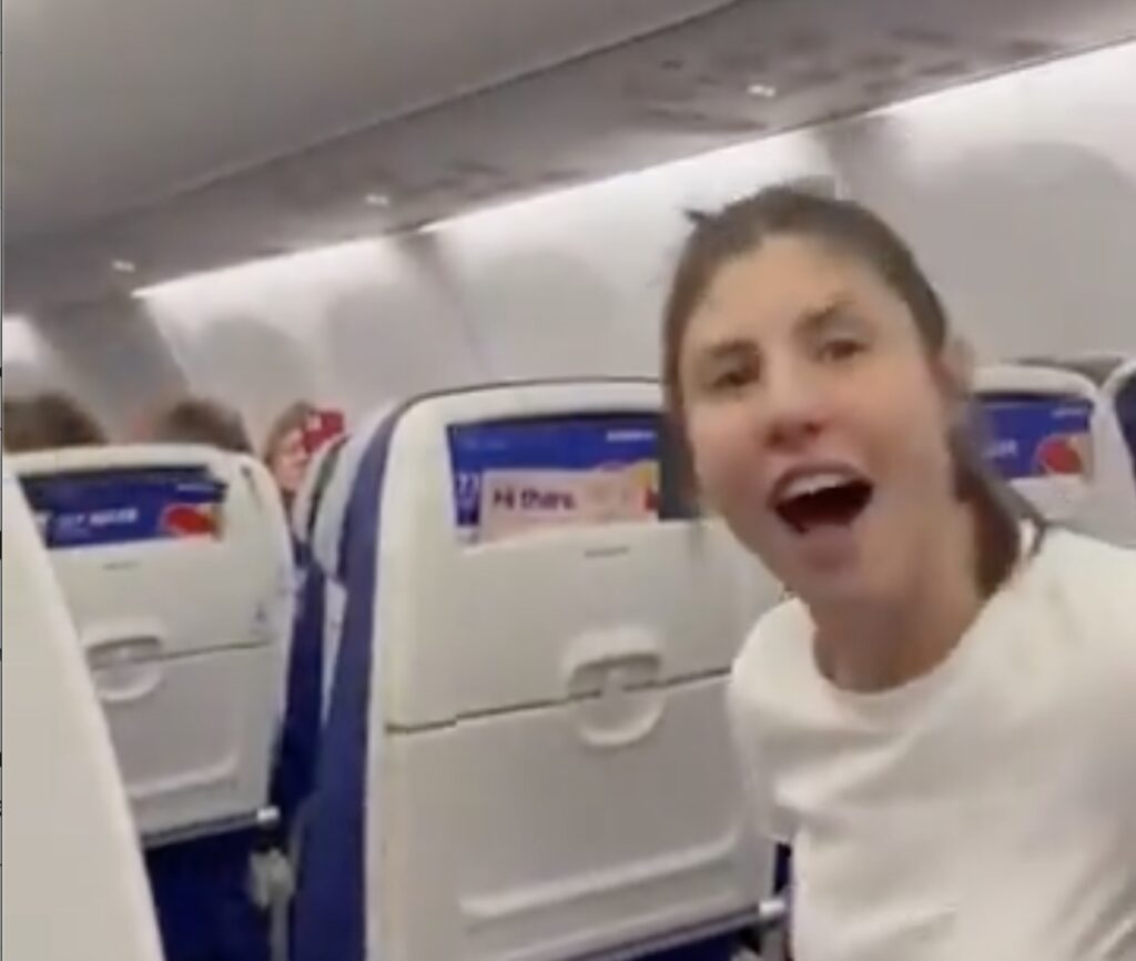 a woman sitting in an airplane