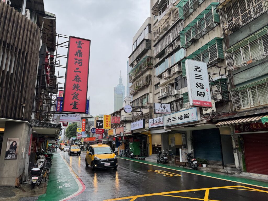 a street with buildings and cars on it