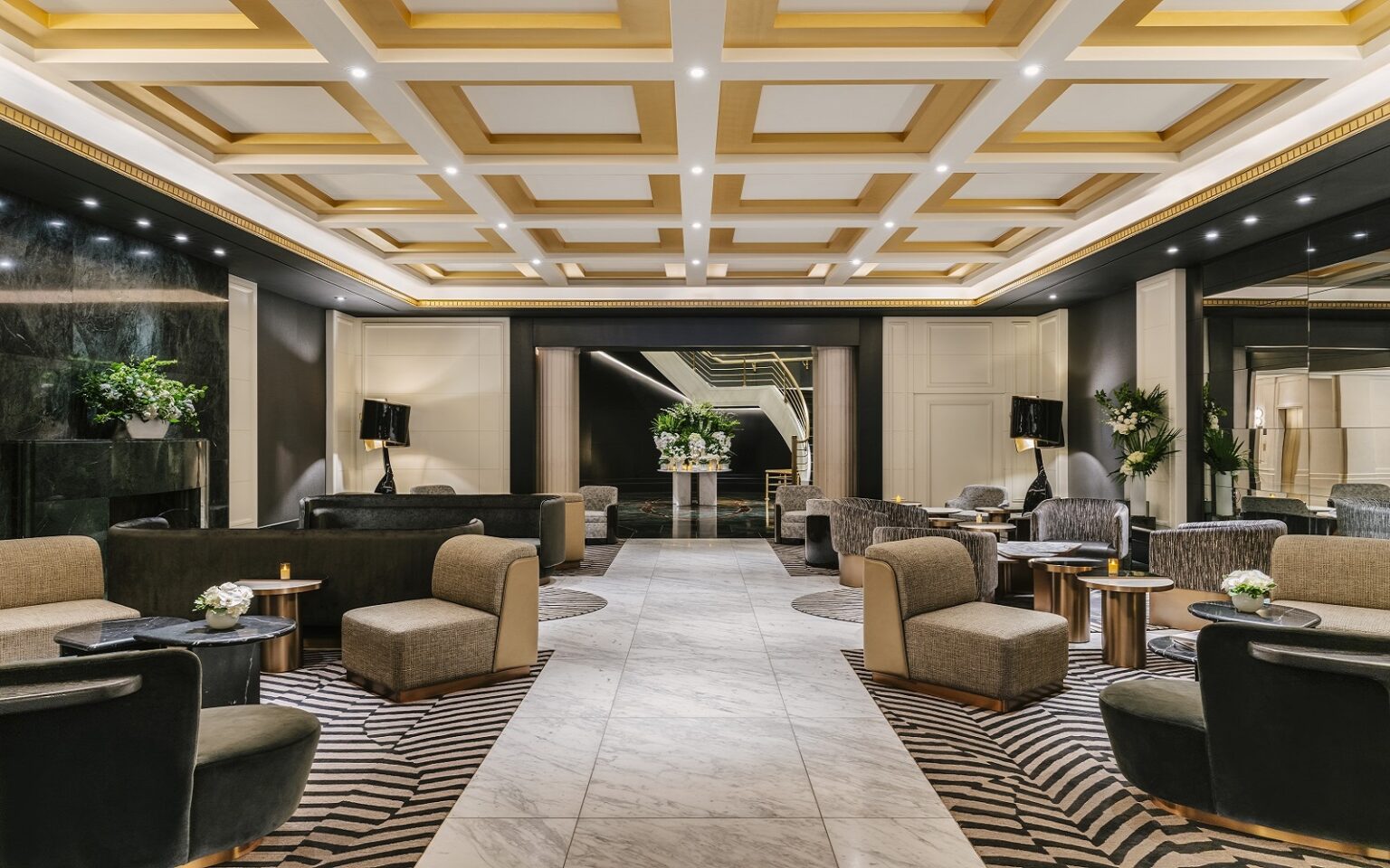 The design transformation of Sofitel New York – a fusion of classic French elegance and modern Manhattan glamour coffered ceiling and striped carpet in Sofitel New York