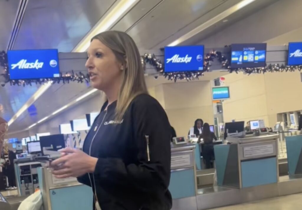 a woman holding a remote control