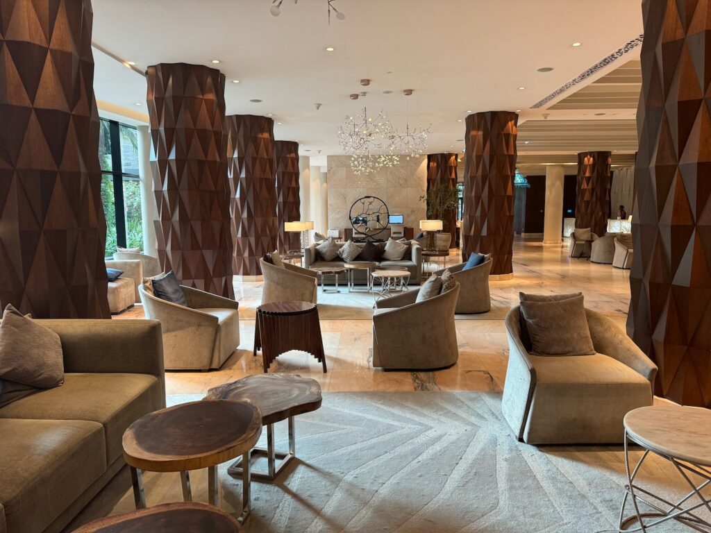 Review: Hyatt Regency Addis Ababa (Flawless Stay) a large lobby with chairs and tables