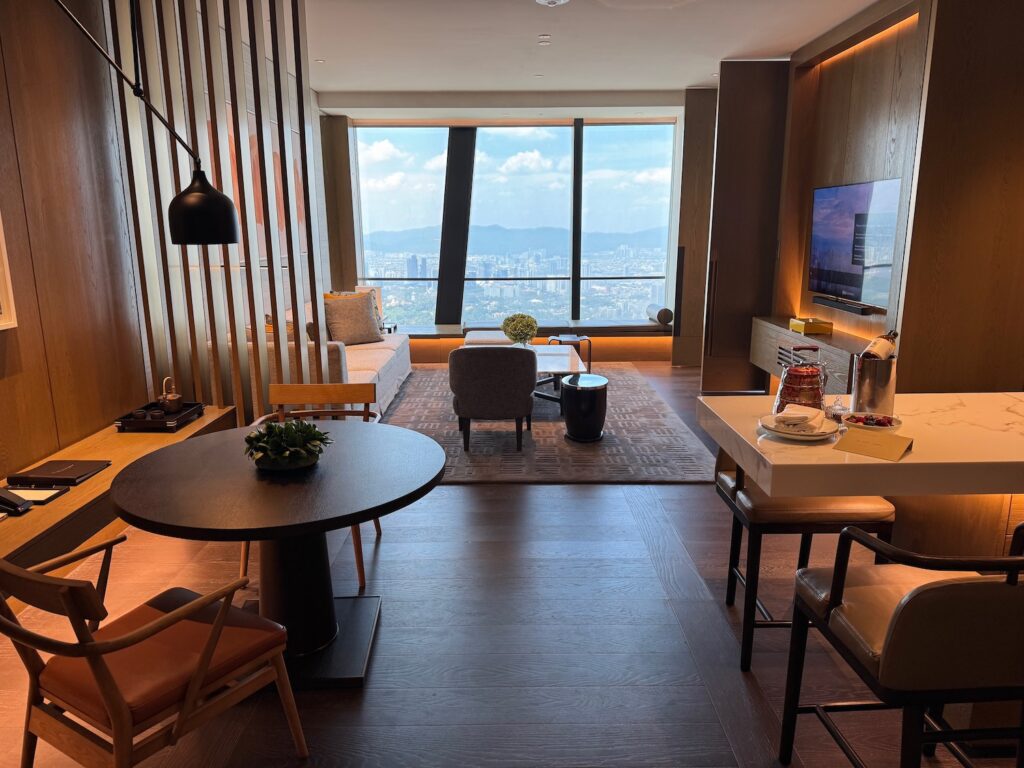 My Top 10 Hotel Stays In 2025 a room with a tv and a table