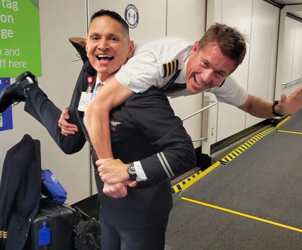 a man carrying another man on his back