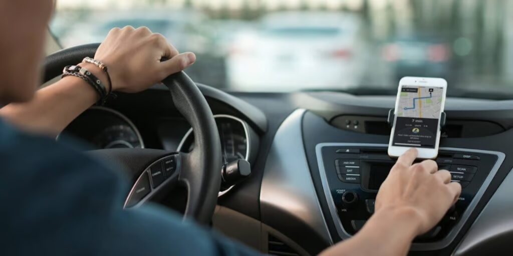 a person holding a steering wheel