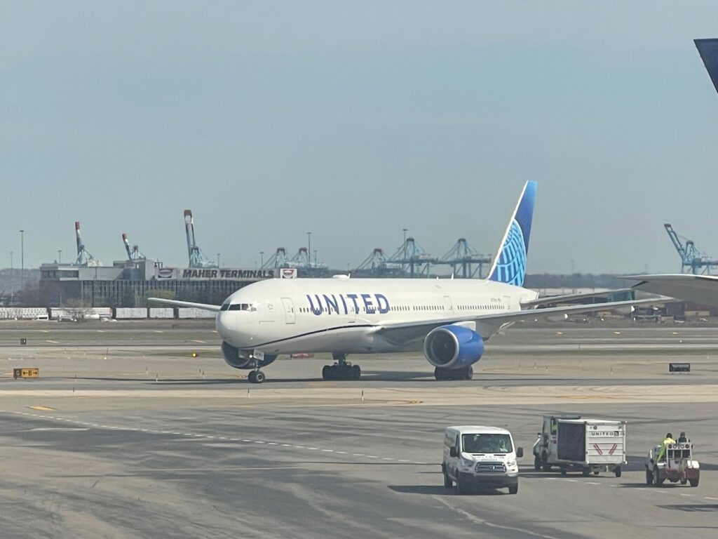 United 777-200 Fleet Faces An Uncertain Future After Dulles Engine Failure a plane on the runway